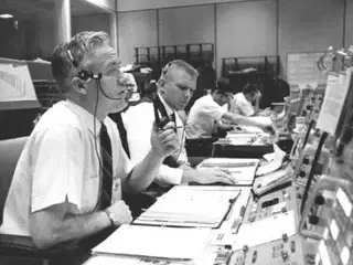 John Hodge (left) flight director. 
