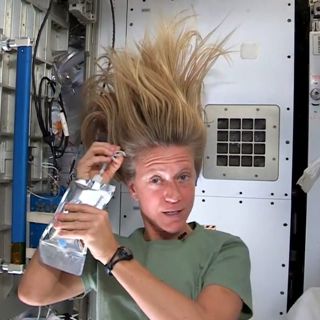 US astronaut Karen Nyberg demonstrates how to wash your hair in space.