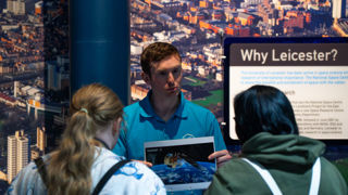 Adults engaging with Science Communicator at Space Lates