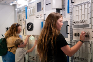 Family Interact With Columbus Module Wall