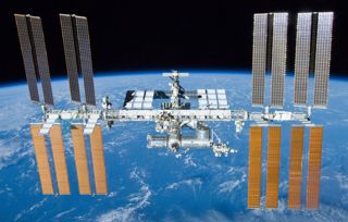 The International Space Station orbiting above the Earth.