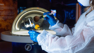 Wine Glass being dusted for fingerprints