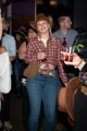 Woman in a Stetson with a bottle of Coke