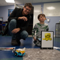 Father and child participating in the LEGO Spike workshop at the Brickish Weekend