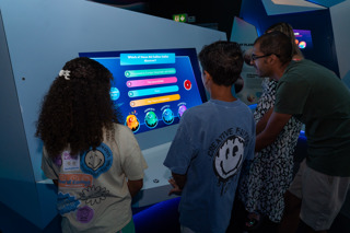 A family taking part in the Quiz at the End of the Solar System