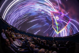 Audience enjoying the fulldome Dark Side of the Moon show in the planetarium