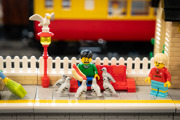 LEGO Minifigure with a hotdog being surrounded by seagulls 