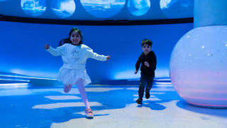 Two children playing in Home Planet gallery