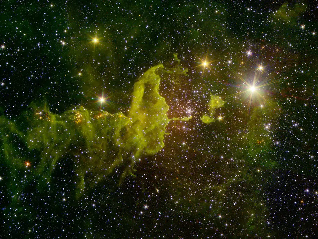 The spider part of “The Spider and the Fly” nebulae, IC 417 abounds in star formation, as seen in this infrared image from NASA’s Spitzer Space Telescope and the Two Micron All Sky Survey (2MASS).