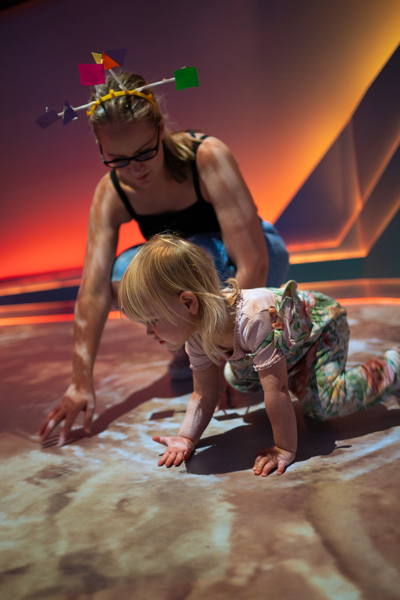 Mother and small child playing on the interactive floor in Home Planet as Small Space Day