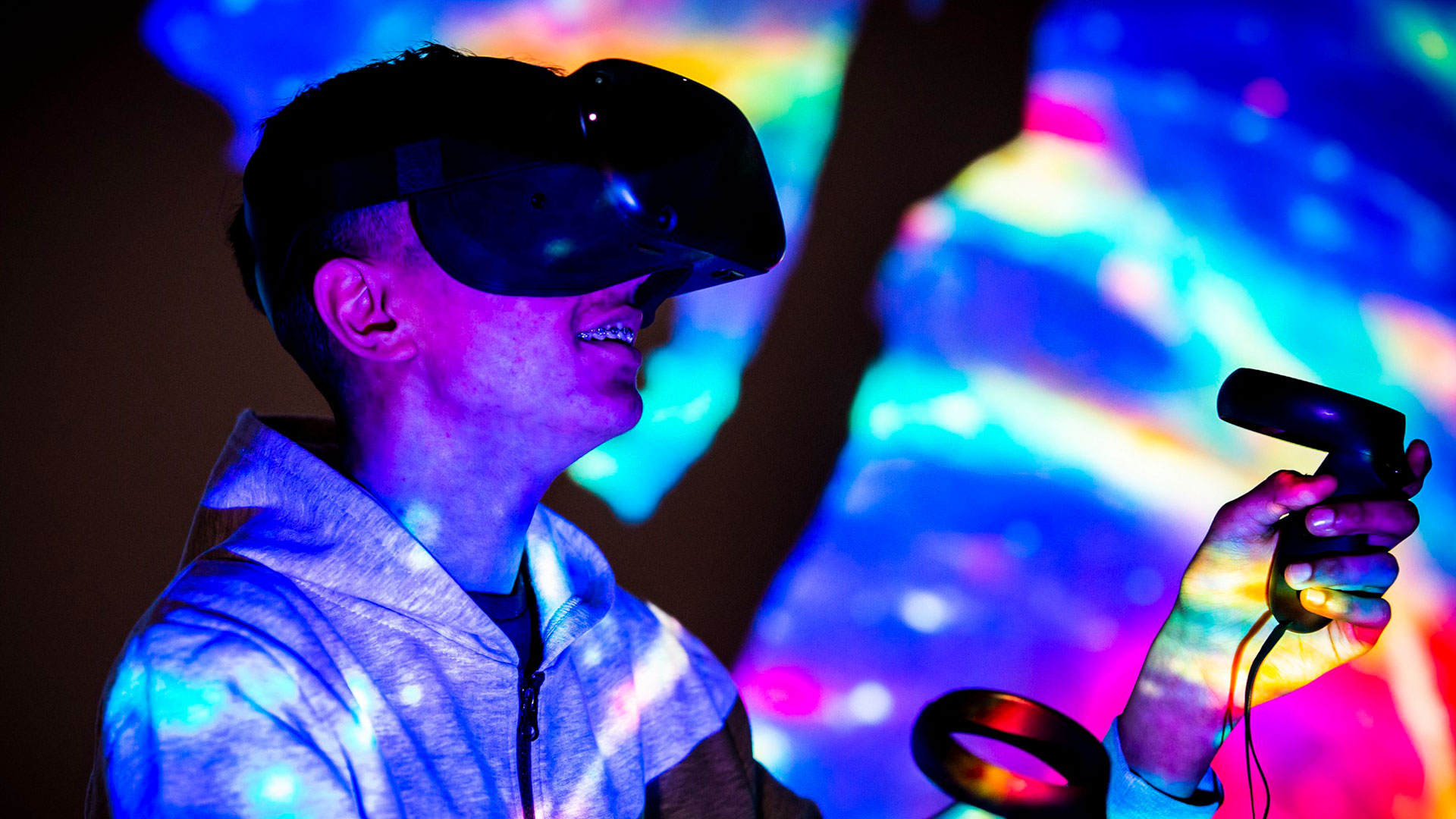Young man with VR headset in the Immersive Academy