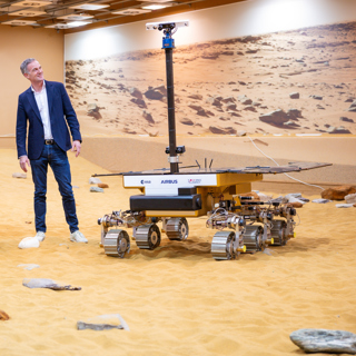 UK Technology Secretary Peter Kyle next to a mockup of the ExoMars Rosalind Franklin rover on display at Airbus's facility in Stevenage in the United Kingdom.