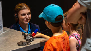 Science Communicator with mother and children at an Accessible Afternoon