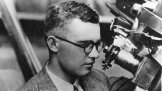 Clyde Tombaugh at the guide scope of the 13-inch astrograph he would use to discover Pluto