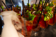Reception drinks in glasses with mint and a straw with smoke