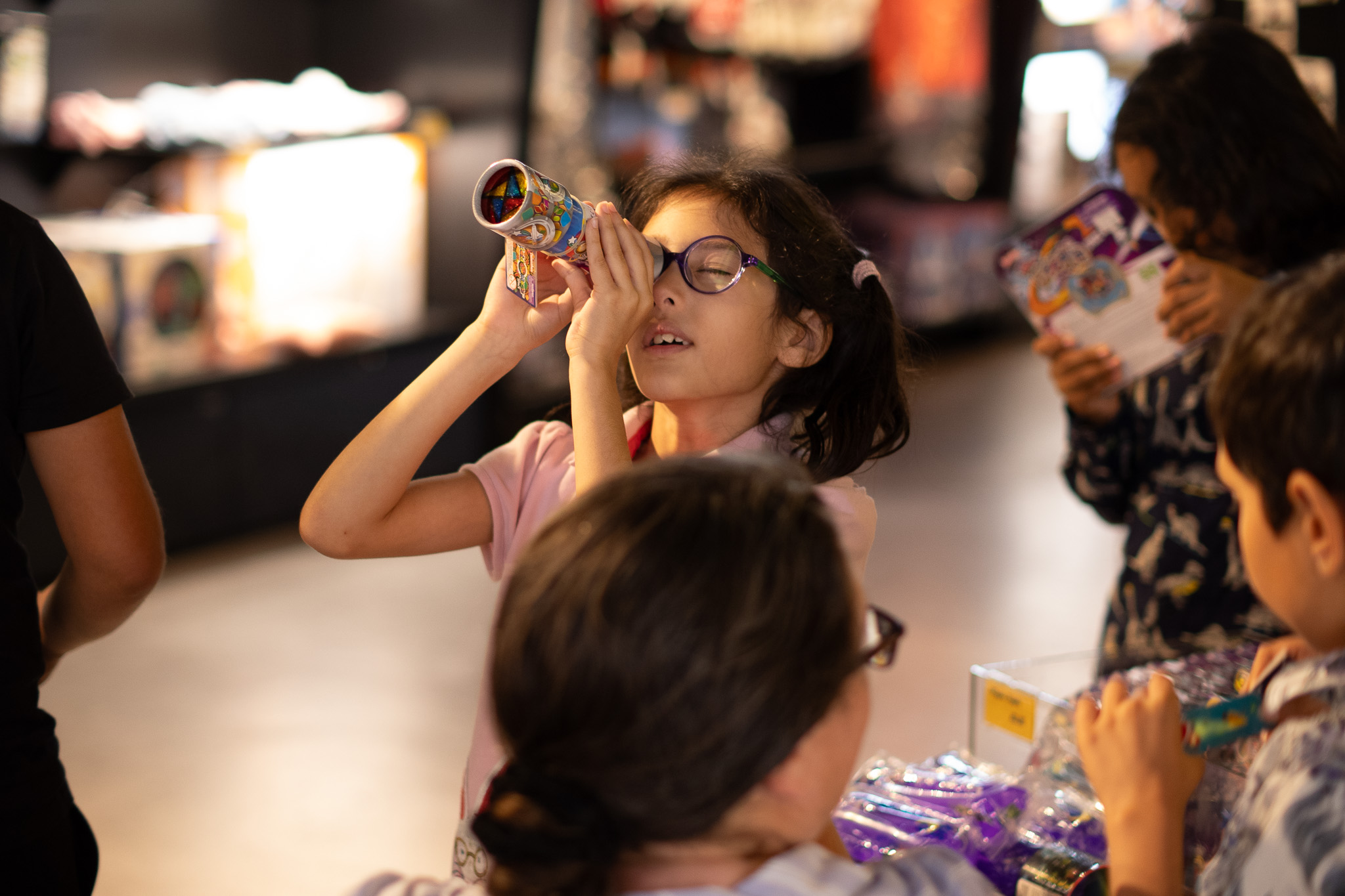 Young Girl looking at items in the shop