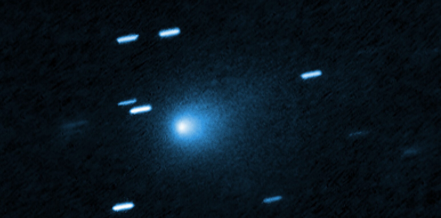 An image of Comet 3I/ATLAS captured by the Hubble Space Telescope, with stars appearing as streaks in the background
