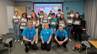 Children with participation certificates after Space Cadets LIVE as part of the IGNITE programme