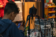 Child photographing the War of the Worlds display at the Brickish Weekend