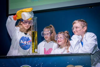 Children performing an experiment in LIVE Space
