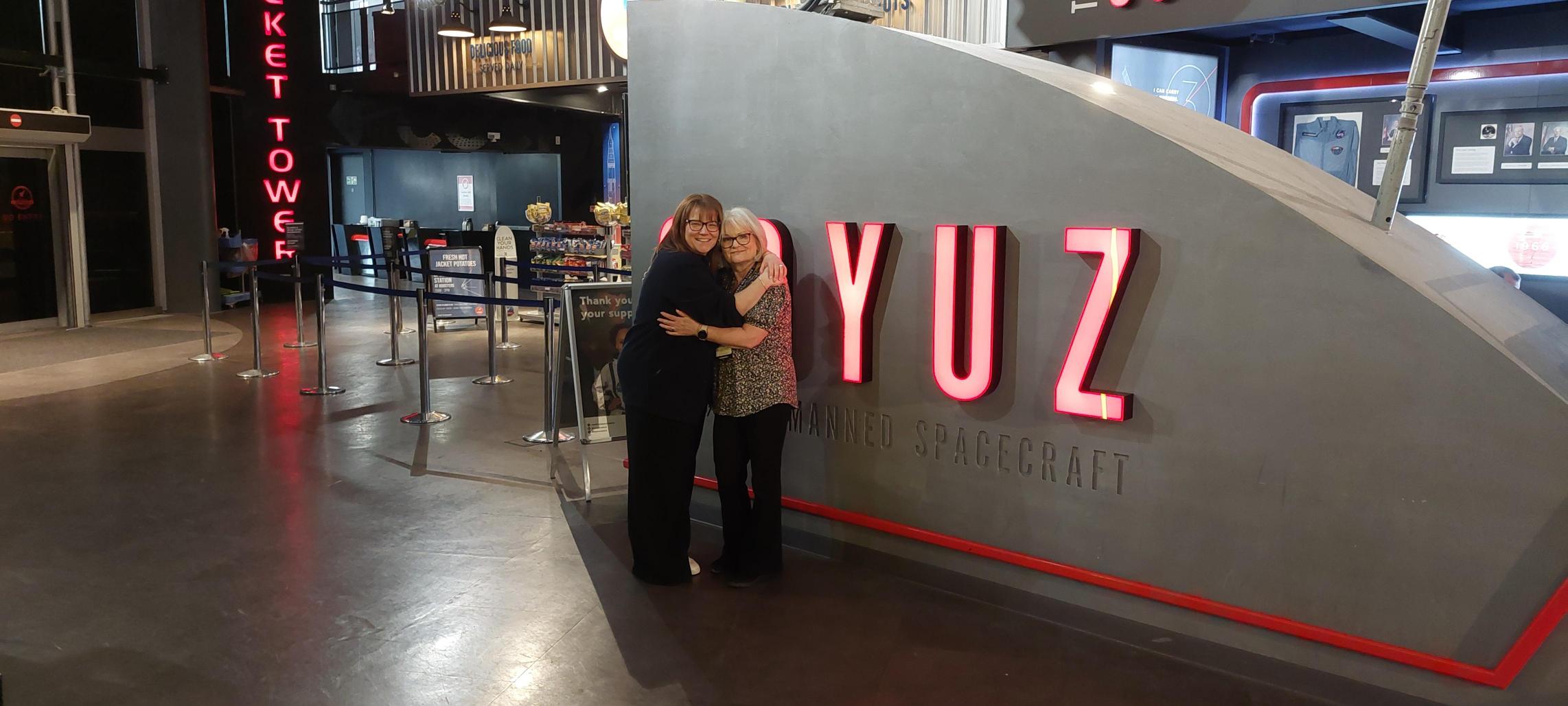 Lisa and Katie in front of Soyuz