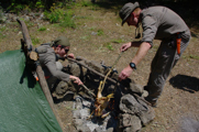 Tim Peake Right Preparing Dinner On The Campfire