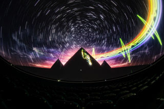Pyramids and rainbow star train on the fulldome as part of Dark Side of the Moon show