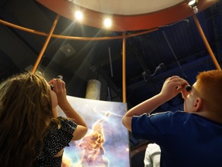 Visitors and the National Space Centre exploring spectroscopy.