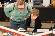 Mother and son looking at a LEGO display