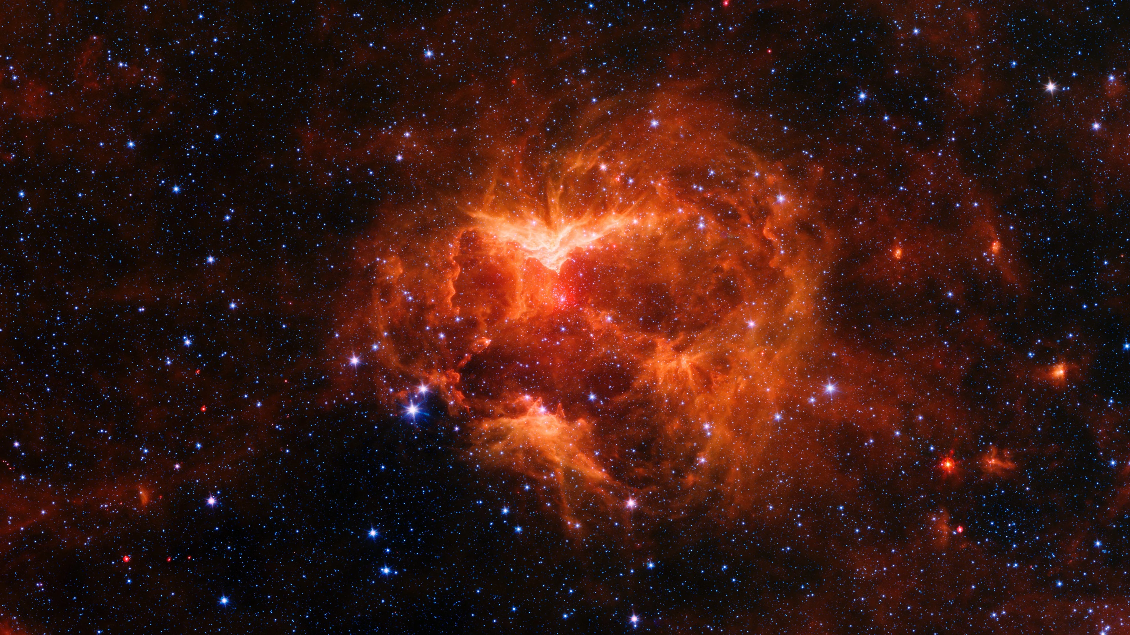 Jack o Lantern Nebula This infrared image from NASA’s Spitzer Space Telescope shows a cloud of gas and dust carved out by a massive star. 
