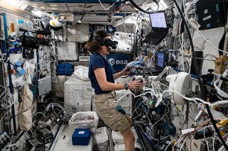 NASA astronaut Megan McArthur using VR to work on robotic arm technology.
