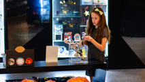 Young Girl looking at items in the shop