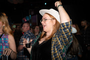 Lady in a white Stetson dancing to the band 
